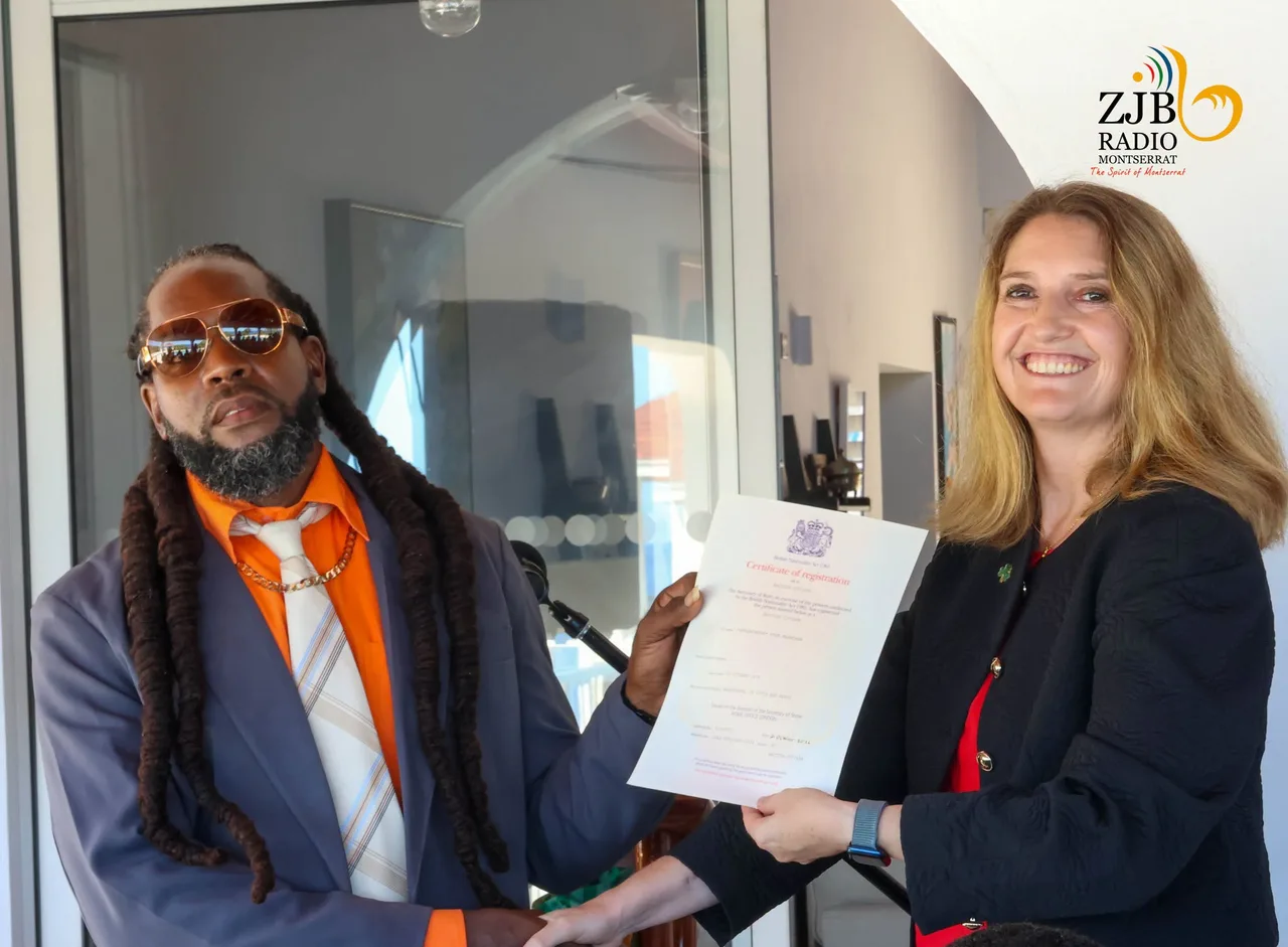 Vere Hendrickson with Montserrat Governor Harriet Cross, holding his British citizenship registration certificate.